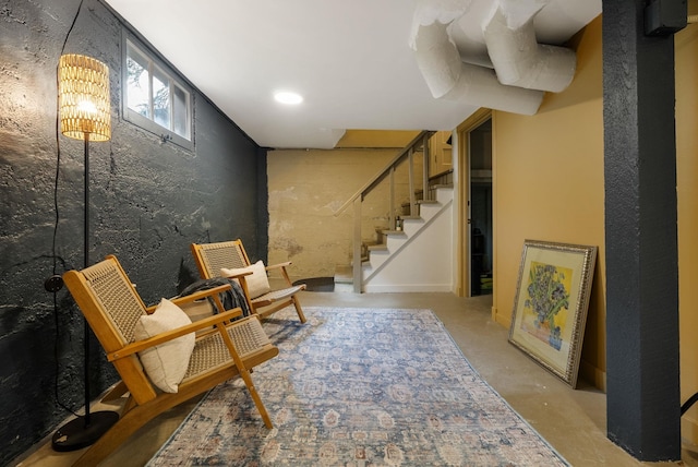 918 W 18th Ave, Spokane, WA 99203 - sitting room featuring concrete flooring and stairway