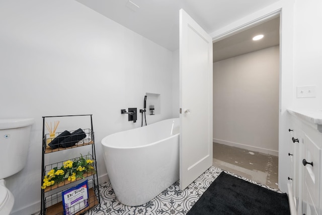 918 W 18th Ave, Spokane, WA 99203 - full bath with toilet, a freestanding tub, vanity, baseboards, and recessed lighting