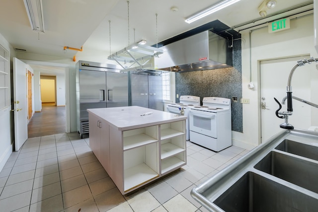 317 College Ave, Cheney, WA 99004 - kitchen featuring white electric range, open shelves, light tile patterned floors, and stainless steel built in refrigerator
