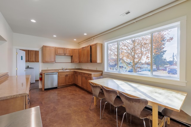 317 College Ave, Cheney, WA 99004 - kitchen featuring stainless steel dishwasher, a sink, washer / dryer, light countertops, and recessed lighting