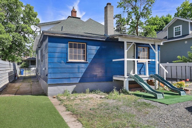 2108 E Pacific Avenue 2110E Pacific Ave Spokane, Wa 99202, Spokane, WA 99202 - back of property featuring a chimney, roof with shingles, and a playground