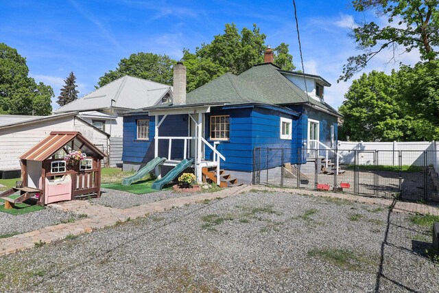2108 E Pacific Avenue 2110E Pacific Ave Spokane, Wa 99202, Spokane, WA 99202 - back of property featuring a gate, a chimney, and entry steps