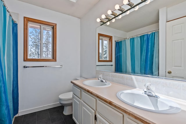 11510 E 20th Ave, Spokane Valley, WA 99206 - full bathroom with plenty of natural light, double vanity, toilet, and tile patterned flooring