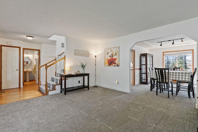 11510 E 20th Ave, Spokane Valley, WA 99206 - interior space featuring stairs, baseboards, arched walkways, and a sink