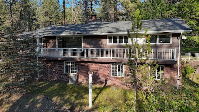17614 N Palomino Rd, Colbert, WA 99005 - rear view of house featuring a chimney, roof with shingles, and a lawn