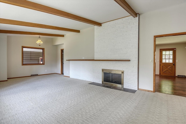 17614 N Palomino Rd, Colbert, WA 99005 - unfurnished living room featuring carpet flooring, beamed ceiling, a brick fireplace, and baseboards