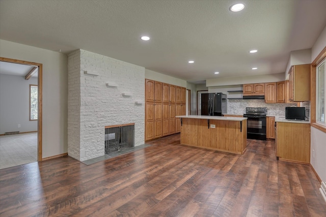 17614 N Palomino Rd, Colbert, WA 99005 - kitchen featuring black appliances, a center island, dark wood-type flooring, recessed lighting, and a textured ceiling