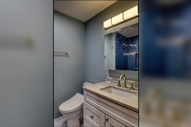17614 N Palomino Rd, Colbert, WA 99005 - bathroom featuring vanity, tiled shower, toilet, and baseboards