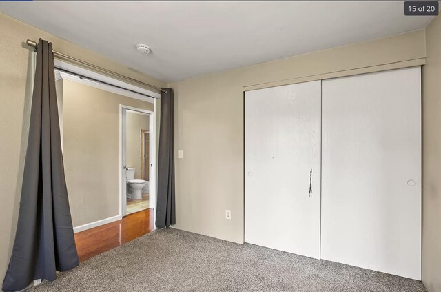 6015 E 6th Ave Apt N2, Spokane Valley, WA 99212 - kitchen with white appliances, a textured ceiling, wood finished floors, ornamental molding, and backsplash