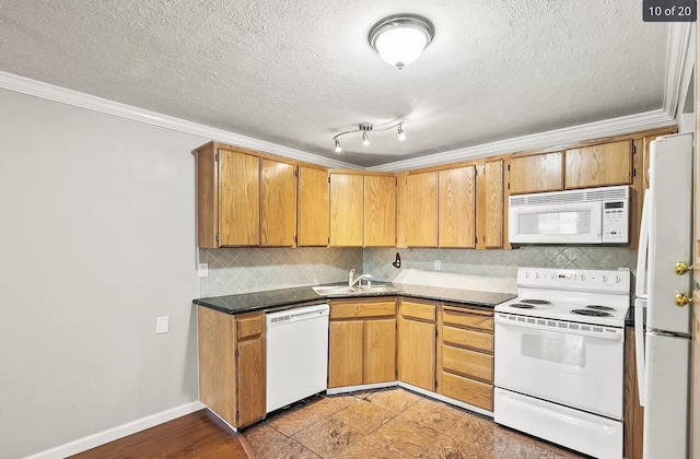 6015 E 6th Ave Apt N2, Spokane Valley, WA 99212 - kitchen featuring white appliances, a sink, tasteful backsplash, crown molding, and a textured ceiling
