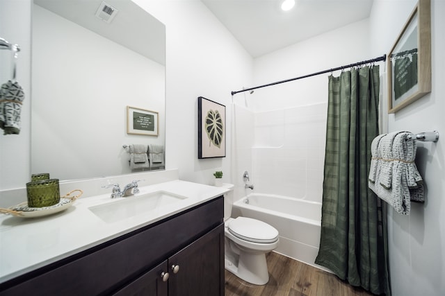 16393 E 30th Ln, Spokane Valley, WA 99037 - full bath featuring wood finished floors, vanity, toilet, and shower / tub combo