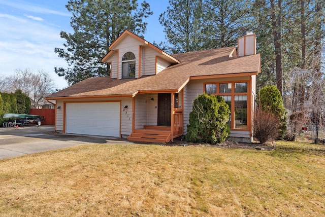 2311 S Mamer Ct, Spokane Valley, WA 99216 - view of front of home with driveway, a chimney, roof with shingles, and an attached garage