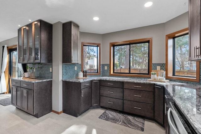 2311 S Mamer Ct, Spokane Valley, WA 99216 - kitchen featuring stainless steel dishwasher, healthy amount of natural light, light stone counters, dark brown cabinets, and recessed lighting