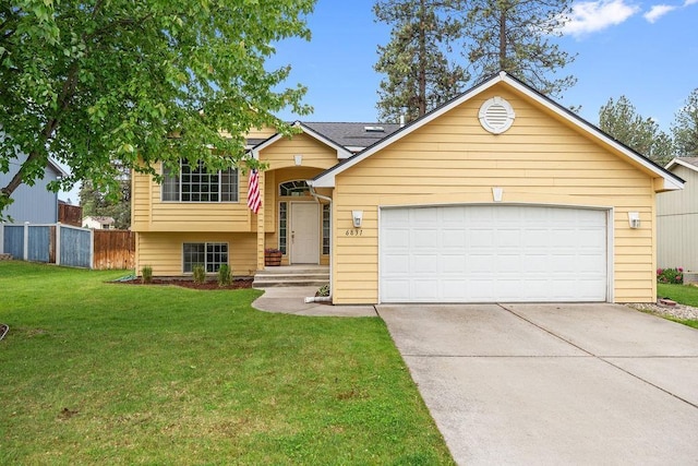 6831 N Cambridge Ln, Spokane, WA 99208 - split level home featuring driveway and an attached garage