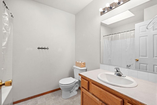 6831 N Cambridge Ln, Spokane, WA 99208 - bathroom with toilet, vanity, and baseboards