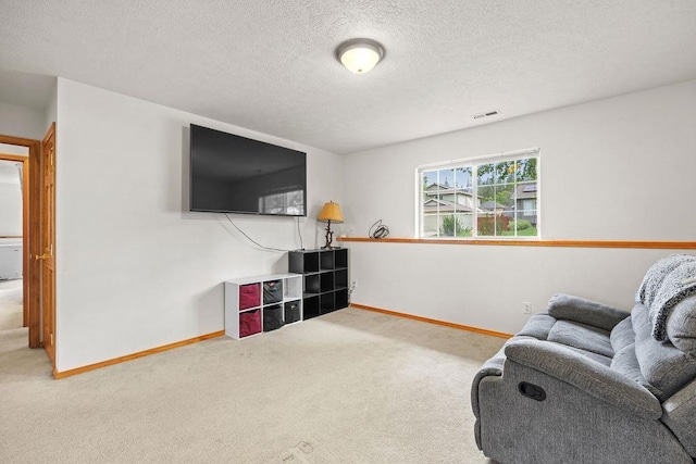 6831 N Cambridge Ln, Spokane, WA 99208 - living room with carpet floors, baseboards, and a textured ceiling