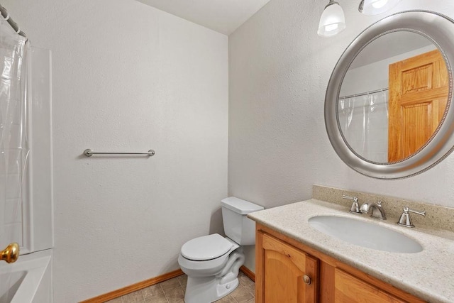 6831 N Cambridge Ln, Spokane, WA 99208 - full bath featuring vanity, toilet, baseboards, and tile patterned flooring