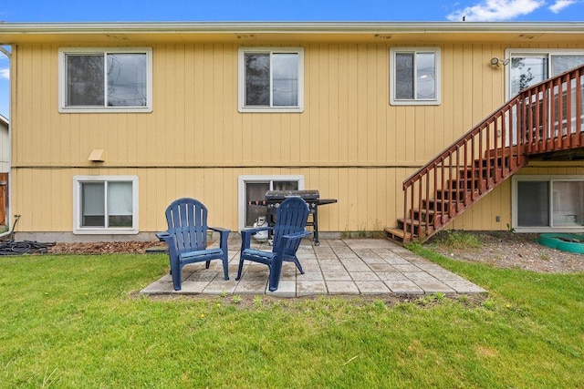 6831 N Cambridge Ln, Spokane, WA 99208 - rear view of house featuring a patio, stairs, and a yard
