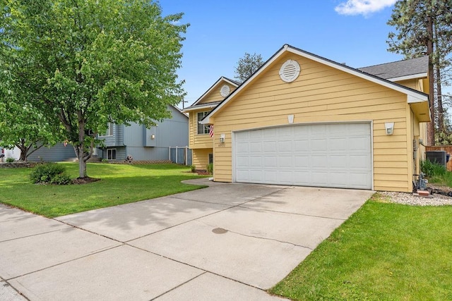 6831 N Cambridge Ln, Spokane, WA 99208 - view of front facade featuring driveway, a front yard, and a garage