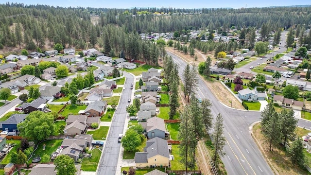 6831 N Cambridge Ln, Spokane, WA 99208 - aerial overview of property's location with nearby suburban area and a heavily wooded area