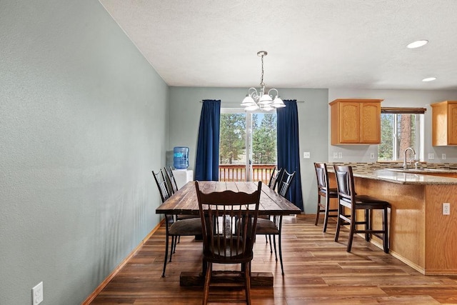 6831 N Cambridge Ln, Spokane, WA 99208 - dining room with a chandelier, wood finished floors, plenty of natural light, baseboards, and recessed lighting