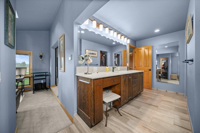 16010 W Jade Ln, Medical Lake, WA 99022 - bathroom featuring double vanity, wood finished floors, baseboards, and recessed lighting