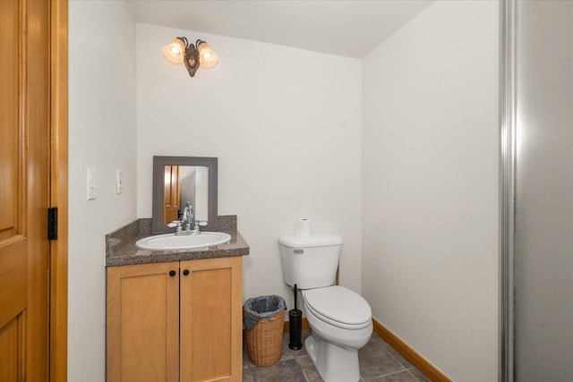 16010 W Jade Ln, Medical Lake, WA 99022 - half bath with vanity, toilet, baseboards, and tile patterned floors