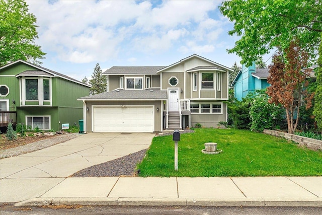 3815 E 19th Ave, Spokane, WA 99223 - split foyer home with concrete driveway, a garage, a front yard, and roof with shingles