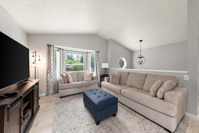 3815 E 19th Ave, Spokane, WA 99223 - living room with light wood-type flooring, lofted ceiling, and baseboards