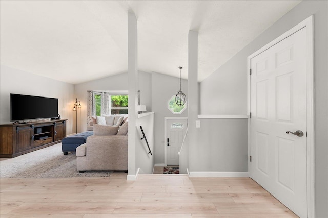 3815 E 19th Ave, Spokane, WA 99223 - living room featuring wood finished floors, lofted ceiling, and baseboards