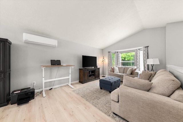 3815 E 19th Ave, Spokane, WA 99223 - living area featuring a wall mounted air conditioner, light wood-style floors, vaulted ceiling, and baseboards