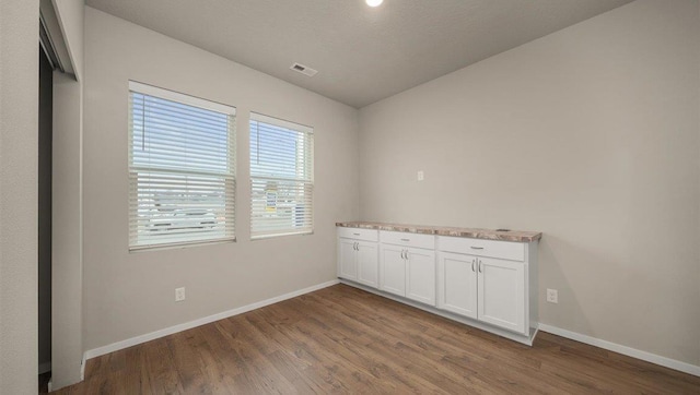 3705 S Keller Ln, Spokane Valley, WA 99206 - unfurnished room featuring baseboards, wood finished floors, and vaulted ceiling