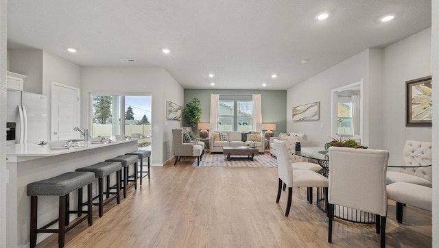 3705 S Keller Ln, Spokane Valley, WA 99206 - dining area featuring healthy amount of natural light, light wood-style flooring, recessed lighting, and baseboards