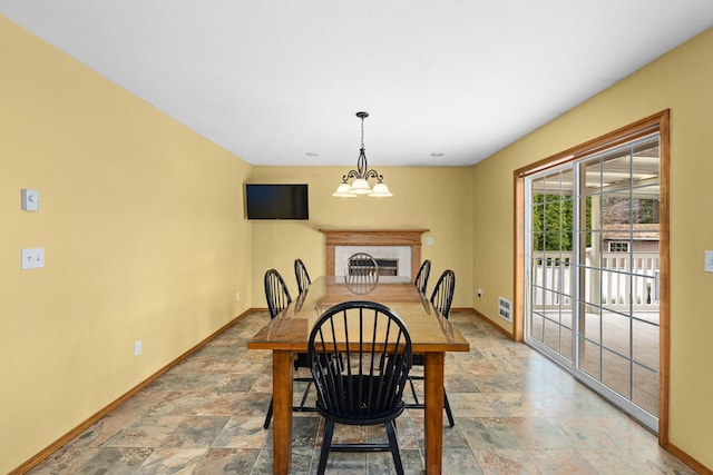 525 Quail Loop, Newport, WA 99156 - dining space featuring baseboards and light stone finish flooring