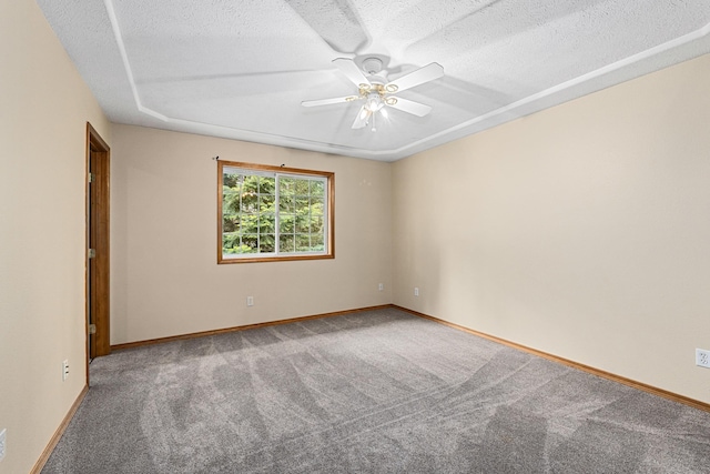 525 Quail Loop, Newport, WA 99156 - spare room with carpet flooring, a ceiling fan, a textured ceiling, and baseboards