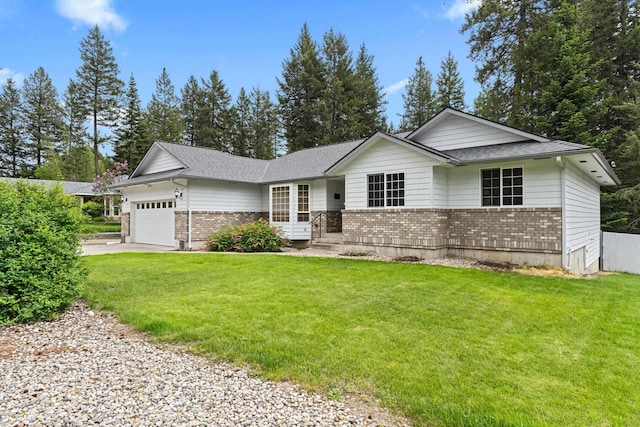 525 Quail Loop, Newport, WA 99156 - ranch-style house with brick siding, an attached garage, a front lawn, and roof with shingles