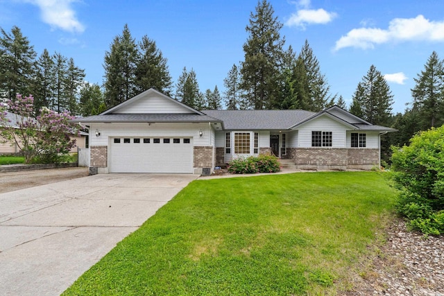 525 Quail Loop, Newport, WA 99156 - ranch-style house with brick siding, an attached garage, and driveway