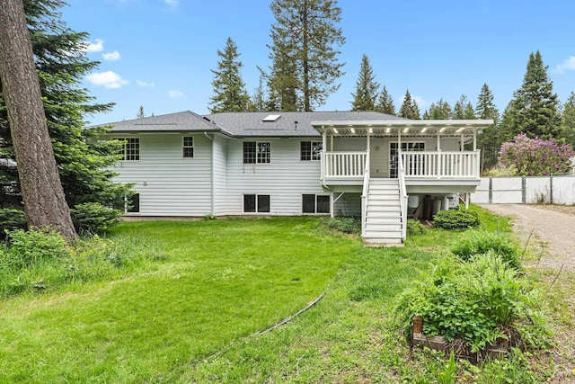 525 Quail Loop, Newport, WA 99156 - back of house with stairway, a wooden deck, and driveway