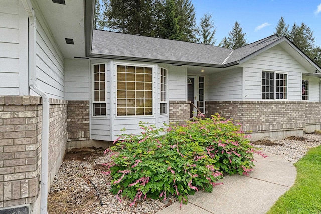 525 Quail Loop, Newport, WA 99156 - entrance to property with brick siding and a shingled roof