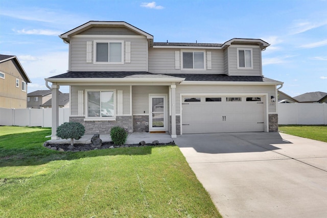 1105 S Oswald St, Spokane, WA 99224 - view of front of property featuring a garage, driveway, stone siding, and a shingled roof