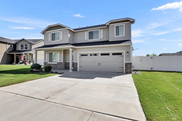 1105 S Oswald St, Spokane, WA 99224 - view of front of home with stone siding, a garage, driveway, and a gate
