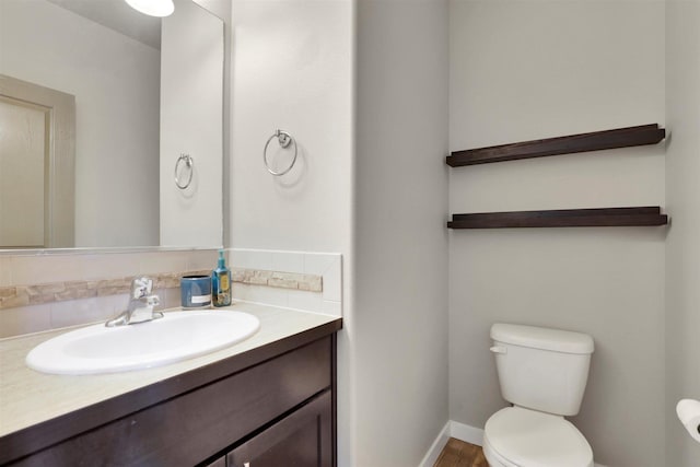 1105 S Oswald St, Spokane, WA 99224 - bathroom with toilet, vanity, tasteful backsplash, and baseboards