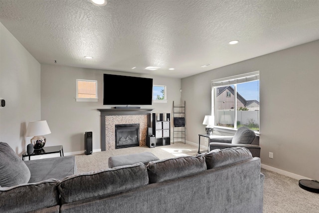 1105 S Oswald St, Spokane, WA 99224 - carpeted living area featuring a tile fireplace, baseboards, a textured ceiling, and recessed lighting