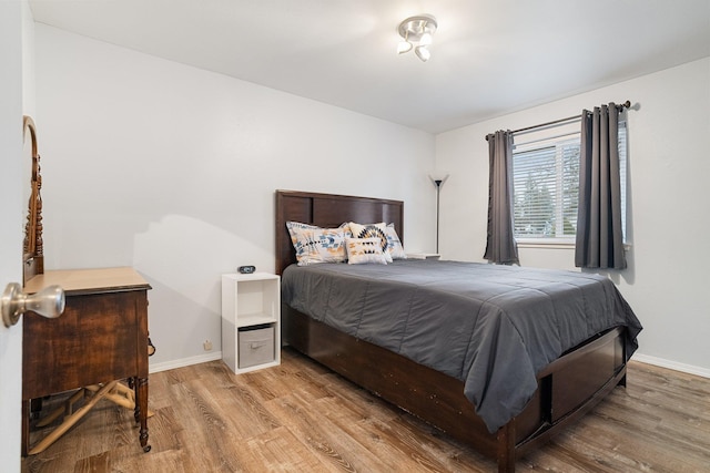 220 W Evergreen Dr, Kettle Falls, WA 99141 - bedroom featuring wood finished floors and baseboards