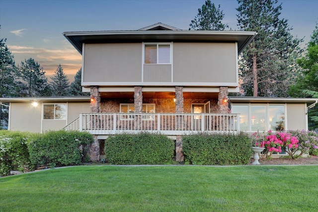 2205 S Conklin Rd, Spokane Valley, WA 99037 - rear view of property with stone siding, a lawn, and a porch