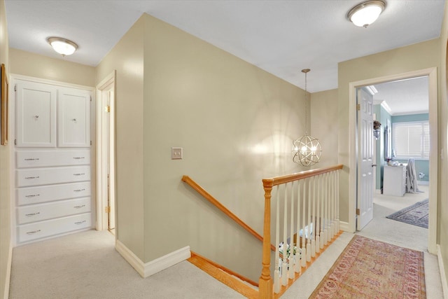 2205 S Conklin Rd, Spokane Valley, WA 99037 - corridor with an upstairs landing, carpet flooring, a chandelier, and baseboards