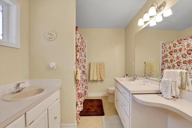 2205 S Conklin Rd, Spokane Valley, WA 99037 - bathroom featuring vanity, toilet, baseboards, and a shower with shower curtain