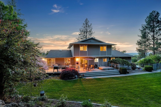 2205 S Conklin Rd, Spokane Valley, WA 99037 - back of house at dusk with a deck