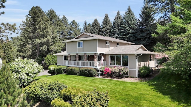 2205 S Conklin Rd, Spokane Valley, WA 99037 - rear view of house with stucco siding, a yard, and a porch