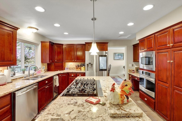 2205 S Conklin Rd, Spokane Valley, WA 99037 - kitchen with stainless steel appliances, a sink, recessed lighting, dark brown cabinets, and light stone countertops